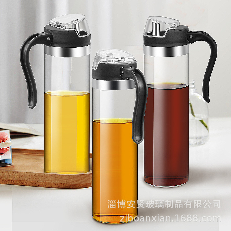 Apertura y cierre automático del engrasador de vidrio boquilla de aceite de acero inoxidable botella de aceite de inducción por gravedad botella de condimento de frasco de aceite doméstico de vidrio