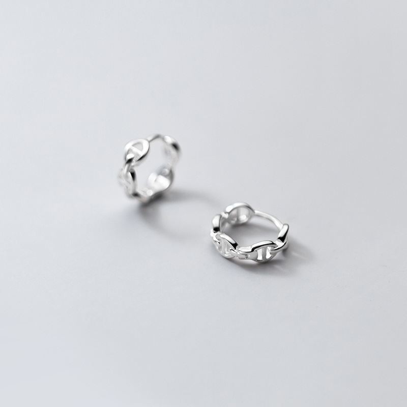 Eloch S925 botón de orejas de plata femenina versión coreana simple nariz de cerdo de moda temperamento geométrico hueco auriculares G8393