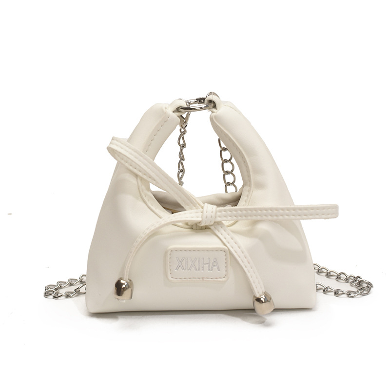 Bolsa de tendencia coreana para niñas, mini bolso de mano simple de color sólido, bolso de accesorios para niños de arco lindo