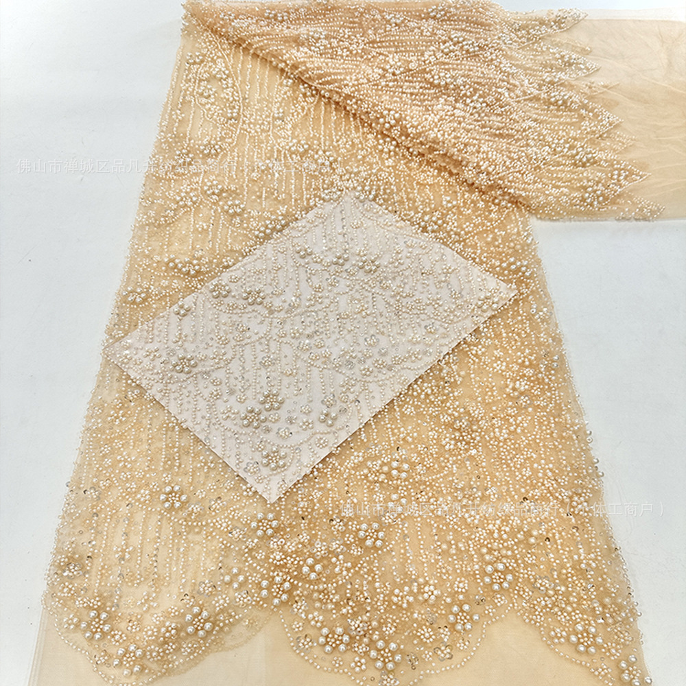 Tejido bordado de tubo de perlas Gao Ding vestido de boda hermoso vestido de rendimiento ropa de moda tela cadena de perlas encaje en stock