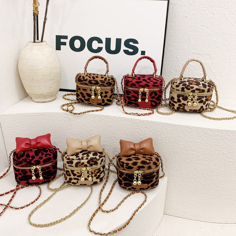 Bolsos para niños de nuevo estilo Bolsos de hombro para niños y niñas con estampado de leopardo de moda coreana Bolsos de mensajero de cadena de bebé con lazo de estilo occidental