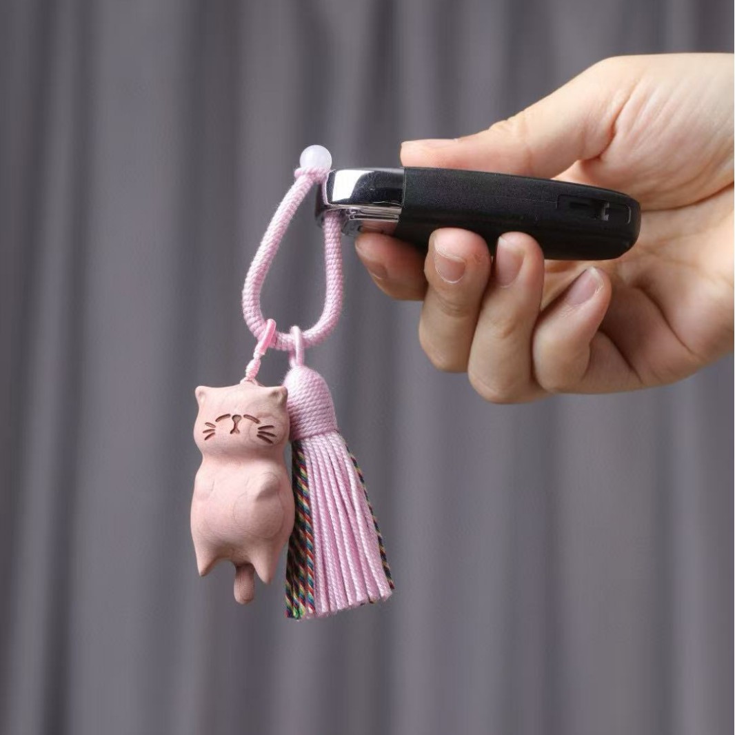 Fabricantes al por mayor de madera de haya, llavero de gato podrido, colgante de bolsa de gato de la suerte, accesorios de manija de dibujos animados, colgante de accesorios