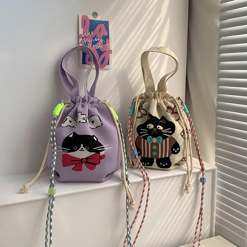 Bolsa de cinturón versátil nuevo patrón de dibujos animados nicho lindo bolso de arroz de almuerzo de cuerda bolso de cubo de mano bolso de brazo