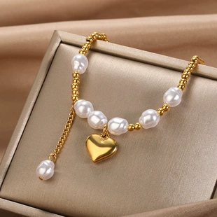 Браслет из стали с жемчугом и сердцем 18k золочение