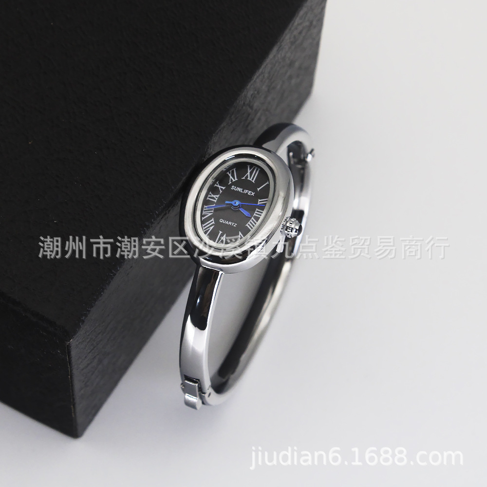 Silver strap black dial watch