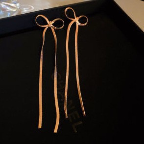 Aguja de plata Pendientes de lazo de diamantes coreanos Pendientes de temperamento de moda de todo fósforo Pendientes de diseño de nicho Sentido de lujo ligero