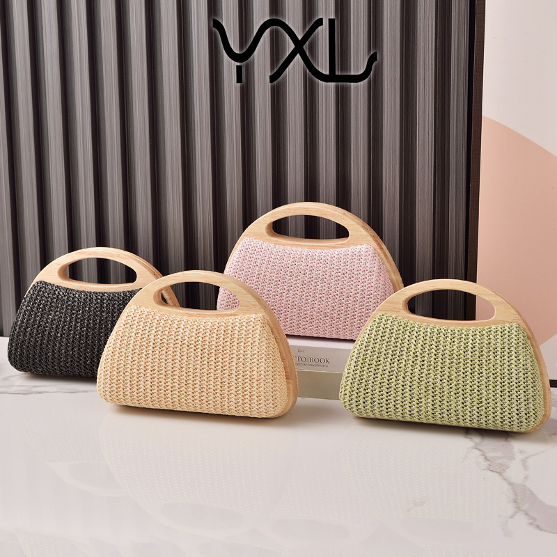 2025 nuevo bolso de mujer con clip de madera maciza tejido de paja bolso de verano de vacaciones junto al mar pequeño bolso de mujer fresco venta caliente transfronteriza