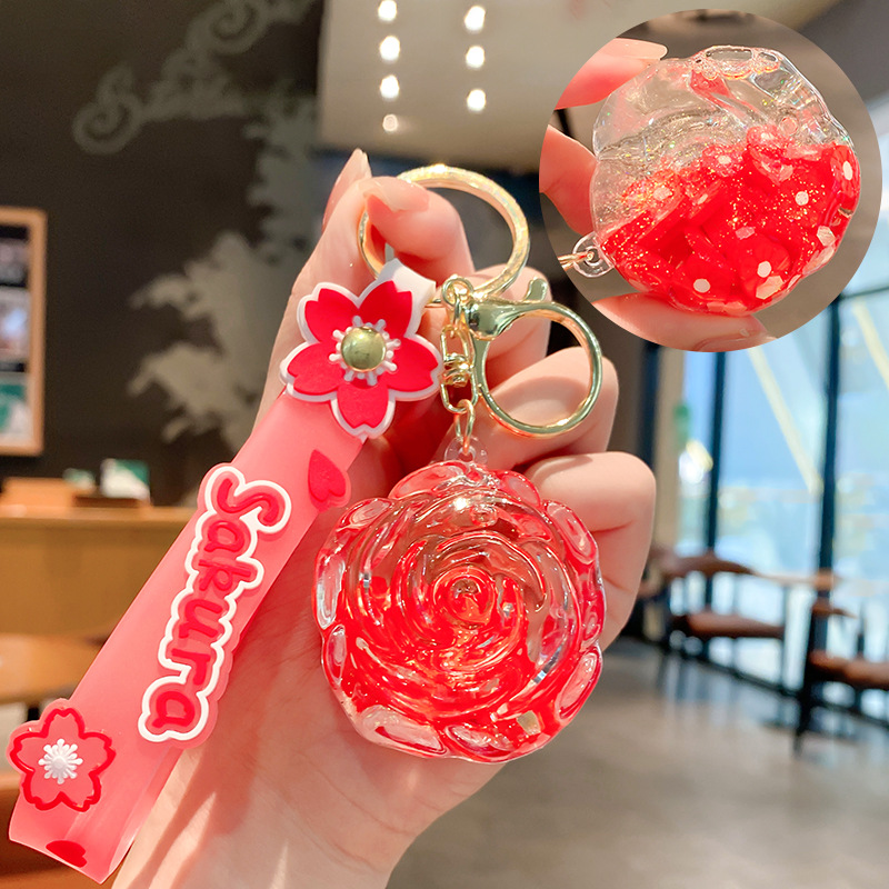Llavero de rosa de aceite creativo lindo líquido arenas movedizas colgantes pequeños bolsos accesorios pareja pequeños regalos al por mayor