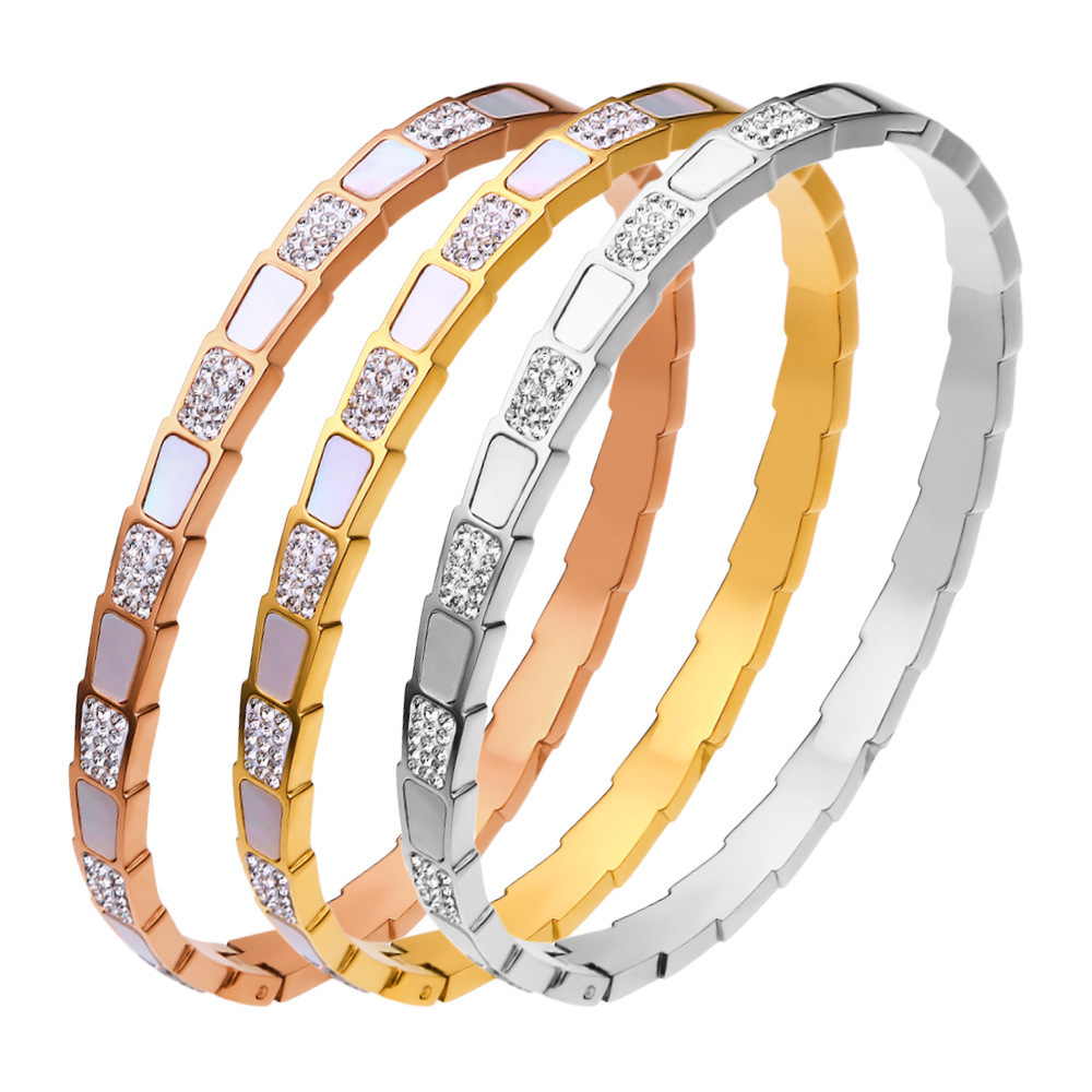 Brazalete de oro de color blanco de lujo ligero nicho chapado en oro transfronterizo nuevo no decolor exquisito brazalete de acero de titanio de apertura para niños