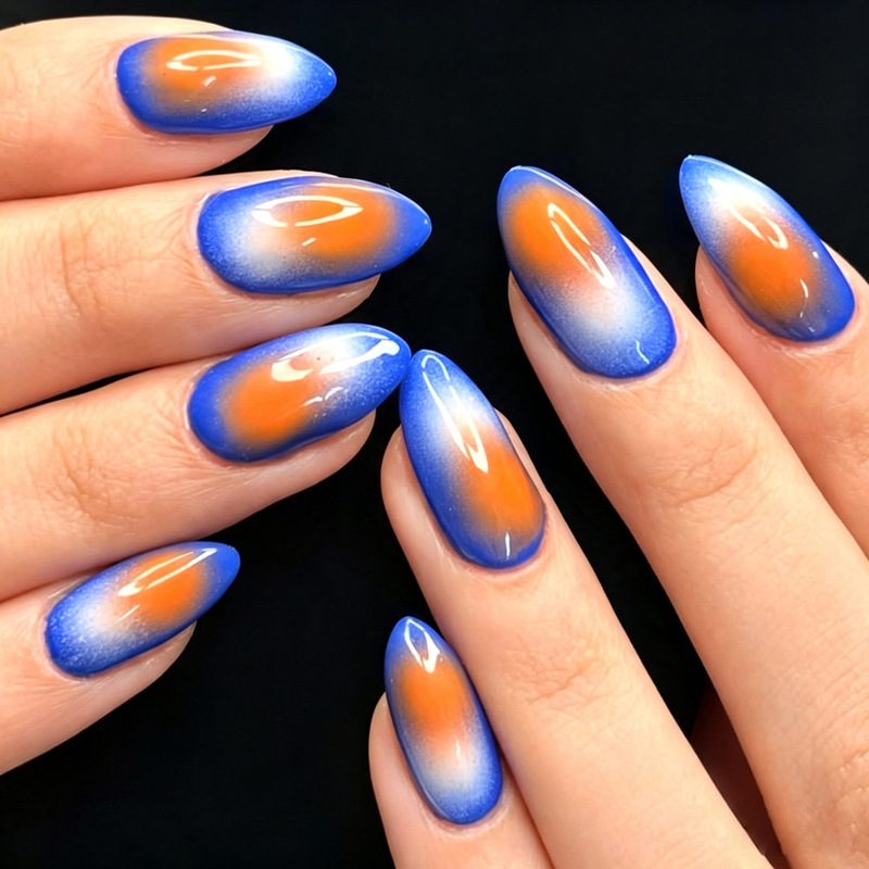 Blue and orange contrasting air gradient almond-shaped press-on nails with artistic aurora effect, fake nail patches for cross-border nail art wholesale Blue and orange contrasting air gradient almond-shaped press-on nails with artistic aurora effect, fake nail patches for cross-border nail art wholesale