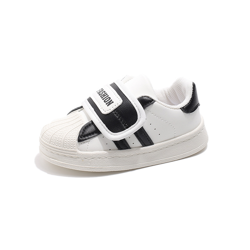 Zapatos blancos para niños 2025 primavera suela suave versátil zapatos infantiles coreanos zapatos de skate para niños y niñas zapatos deportivos