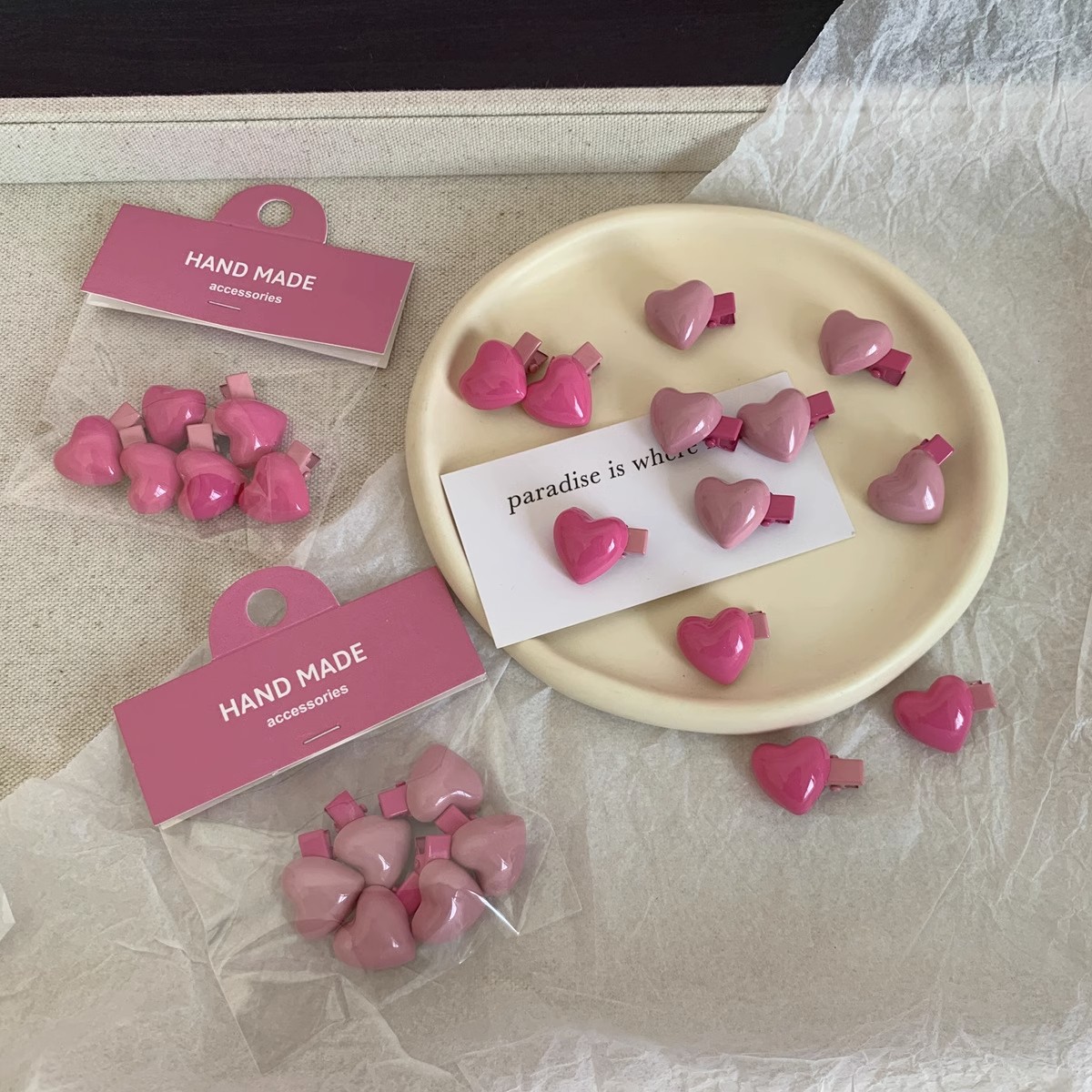 Sweet heart-shaped hair clip in pink peach color scheme, Instagram style, cute mini bangs clip with frayed edges
