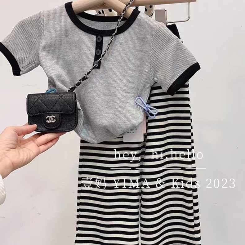 Summer retro Hong Kong style Chanel-inspired two-piece fashion set for girls: T-shirt, striped wide-leg pants, and trendy baby girl outfit.