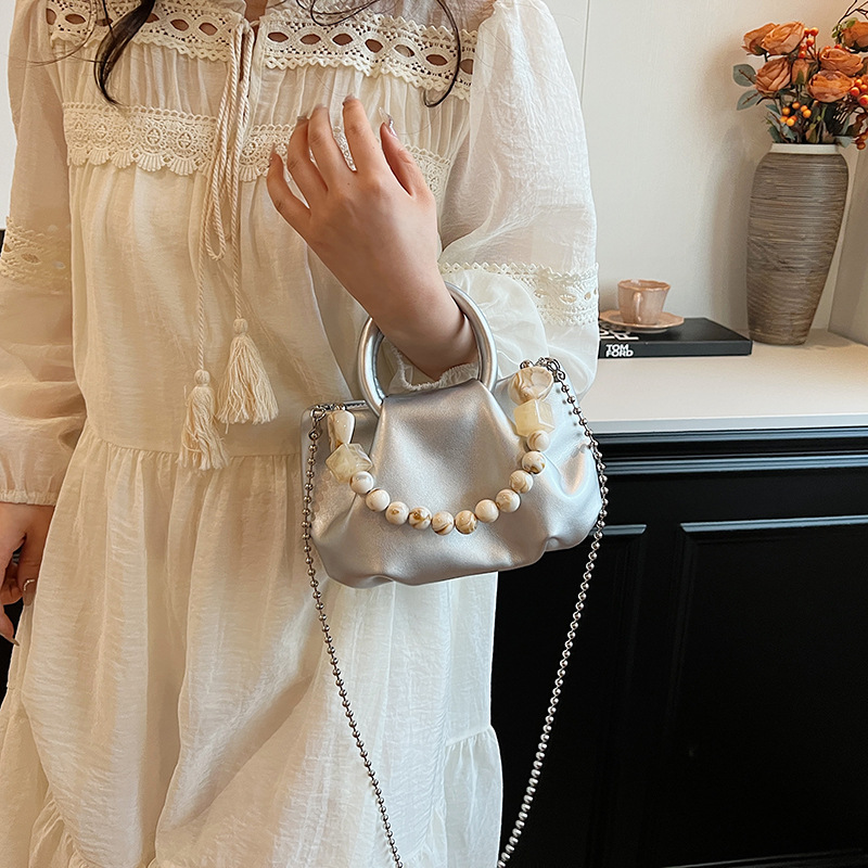 High end handbag for women in 2024, new niche design, summer handheld pleated chain strap, crossbody cloud bag_voghion.com