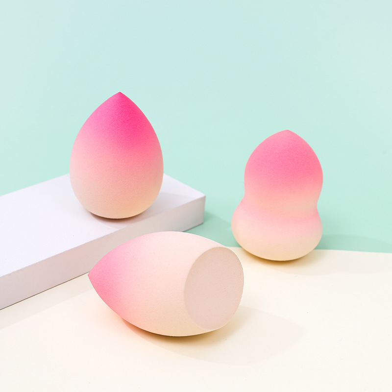 Fábrica personalizada de color degradado transfronterizo maquillaje de belleza soplo de huevo no come polvo no látex color spray gota de agua esponja de maquillaje de calabaza