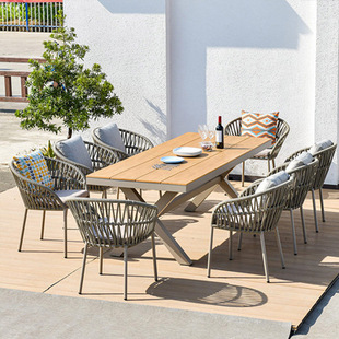 Manufacturer Nordic Outdoor Rattan Dining Table and Chair Combination Waterproof Sun Modern Villa Courtyard Outdoor Leisure Chair Designer