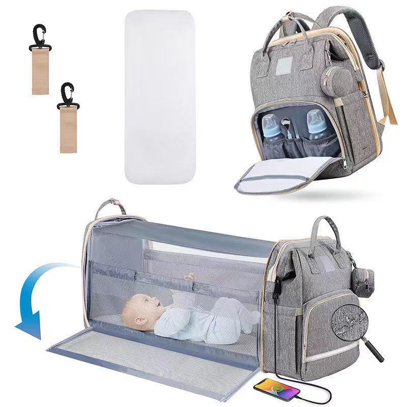 新款多用途折叠婴儿床带蚊帐遮阳母婴包可挂童车便携式双肩妈咪包