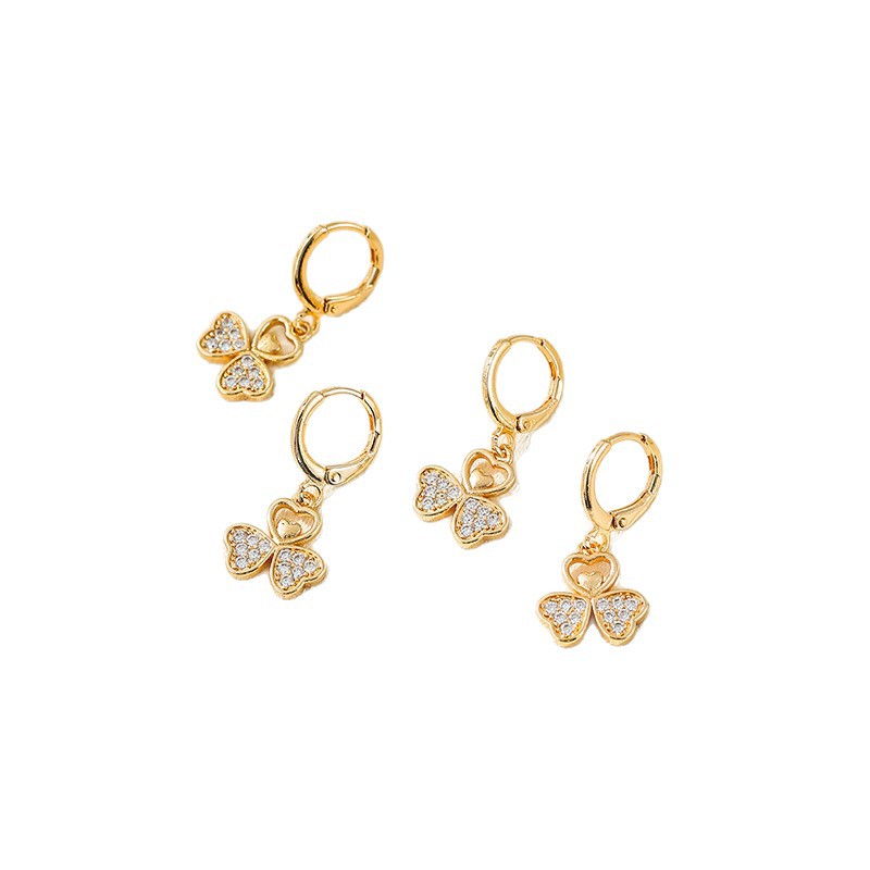 Aretes de trébol de lujo ligero en 2025 nuevo estilo de nicho de diseño de botones de orejas de borda de alta calidad de moda para mujeres aretes de orejas
