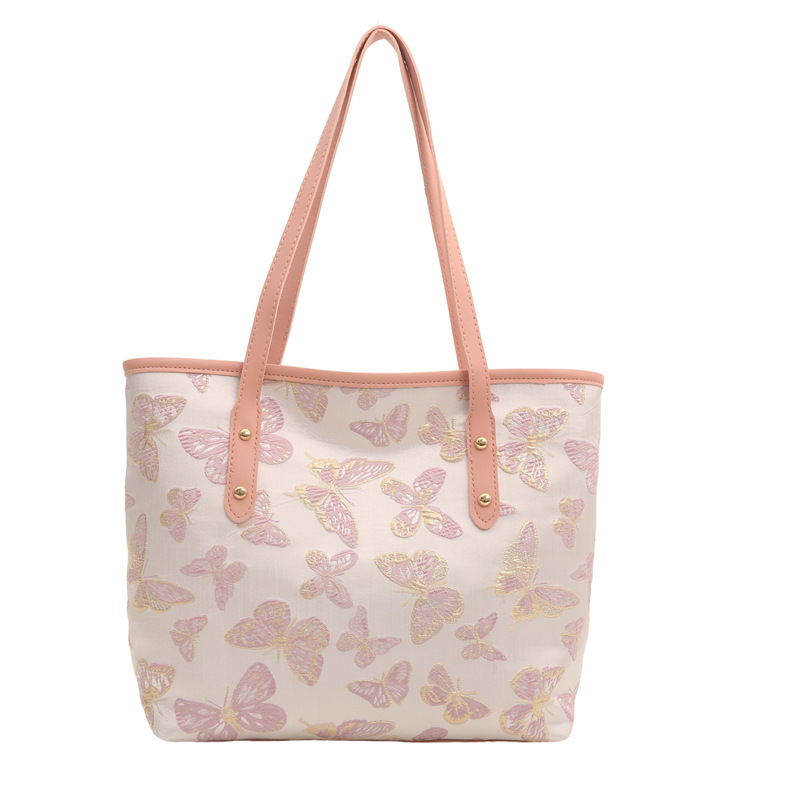 Nueva primavera y verano, nueva bolsa china de gran capacidad, estilo nacional de mariposa bordada bolsa de cubo, bolsa de hombro casual versátil.