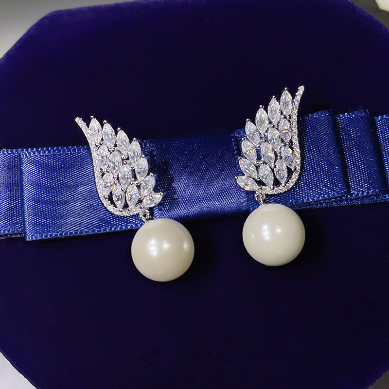 Boucles d oreilles pendantes perle ailes d ange élégantes_voghion.com