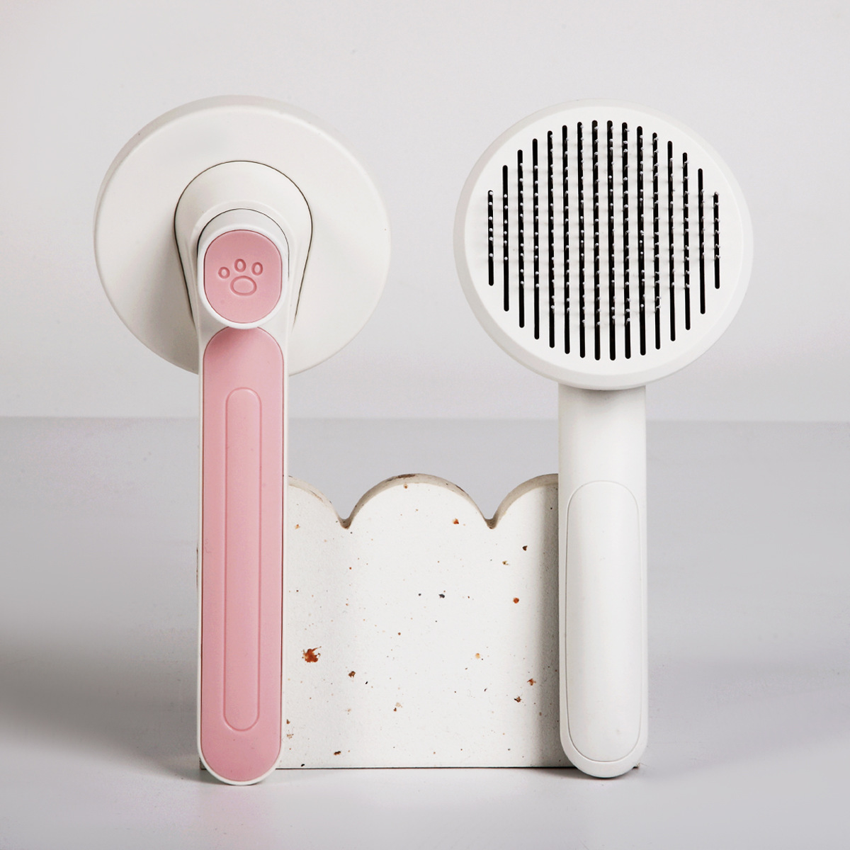 Transfronterizo nuevo peine para mascotas gato y perro universal de limpieza automática de Peine macaron de color mascota flotante peine de masaje para el cabello