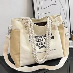 大学生のキャンバスバッグの新商品は、女性の大容量の通勤バッグ2024ファッションのシングル肩です。