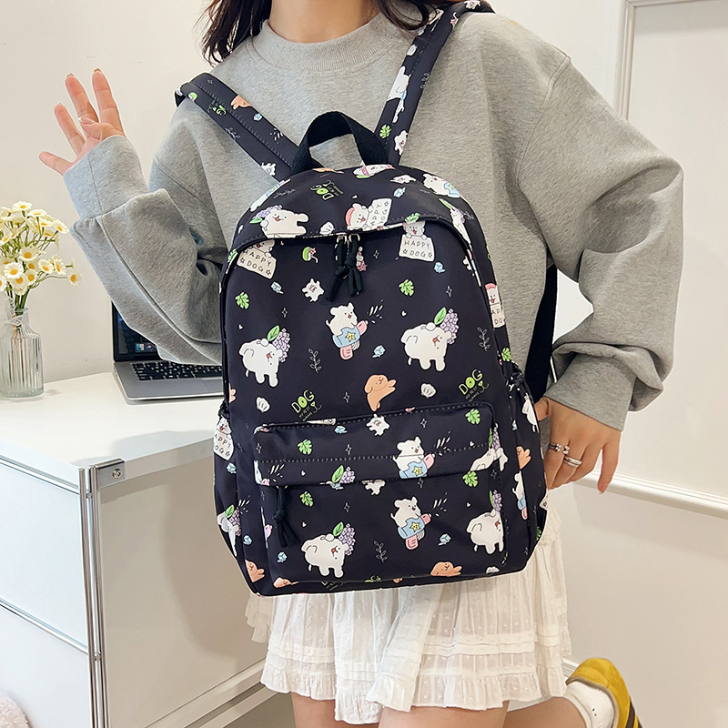 Mochila de graffiti de dibujos animados ligera, mochila de gran capacidad japonesa, mochila de estudiantes de escuela secundaria pequeña y fresca.