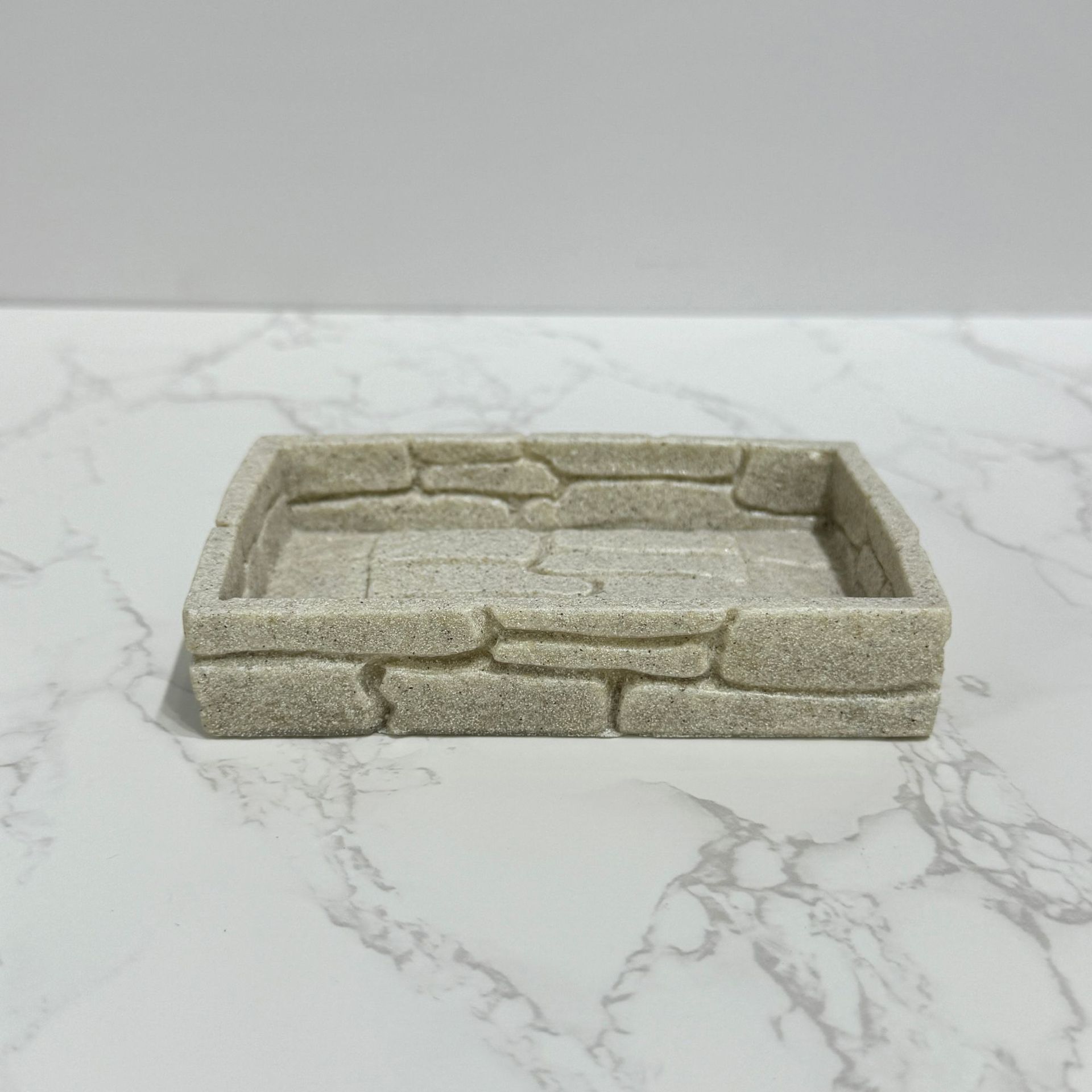 Imitación de diseño de arena y grava, baño de cuatro piezas, juego de decoración de baño de hotel de estilo europeo, botella de desinfectante de manos transfronterizo