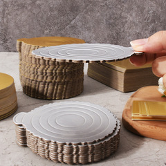 A triangular mousse base cake, with a round layered serving plate, a small golden card paper cake stand, and a mousse cake slice serving tray.
