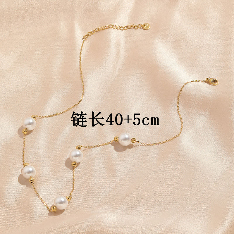 Cruz-frontera exquisita perla bola de acero collar de acero de titanio nicho femenino joyería de acero inoxidable Luz de lujo todo partido colgante fabricante