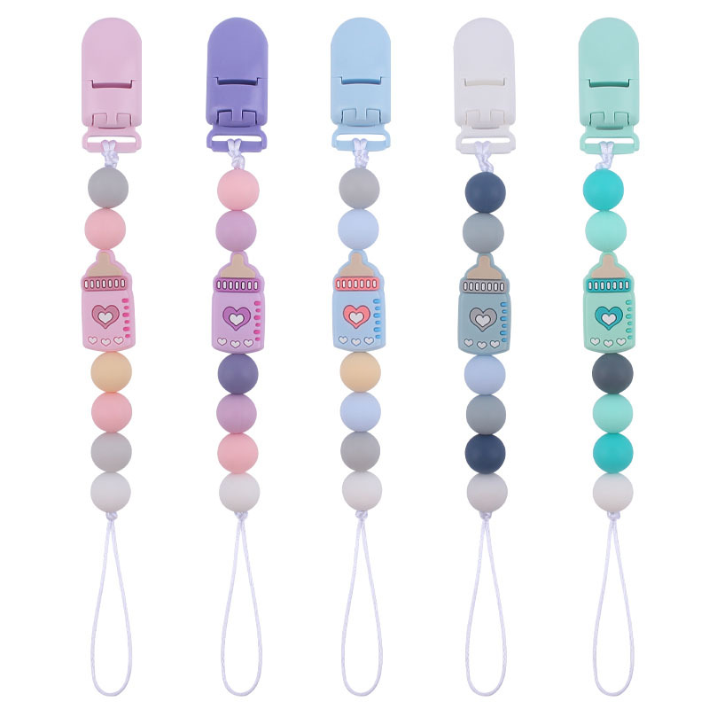 Nuevo bebé suministros clip de plástico de color calmante bebé de dibujos animados biberón de silicona mordedura pezón cadena anti-caída