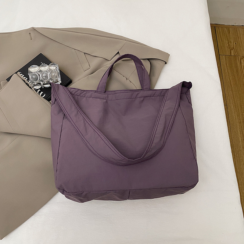 Simple relajado sensación de gran capacidad bolso de lona de hombro de mujer hollow viento versátil bolso de mochila