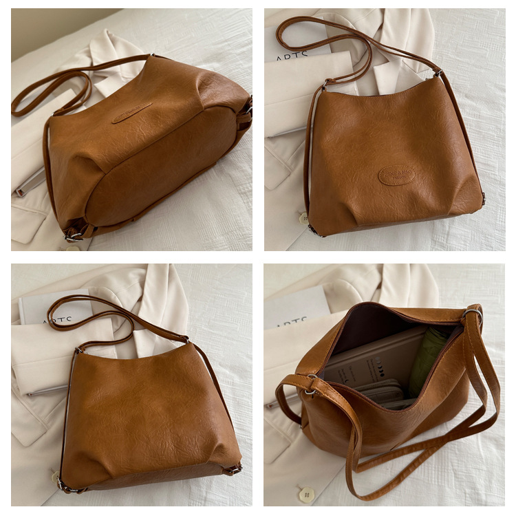 The 2024 new pleated tote bag is a large-capacity casual and fashionable backpack for women, featuring multi-functional texture and a single-shoulder crossbody bag undefined