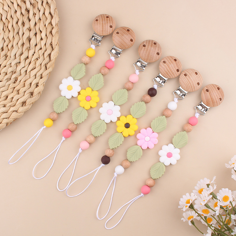 Nuevos productos para bebés Clip de chupete de haya Creativo bebé Silicona margarita mordida molar cadena de chupete anti-caída