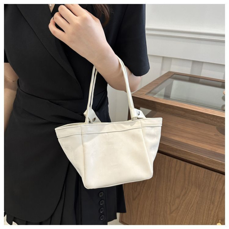 올해 인기있는 작은 가방 작은 디자인 한국 핑크 야채 바구니 가방 여성을위한 새로운 중국 스타일 올 매치 슬렁 버킷 가방