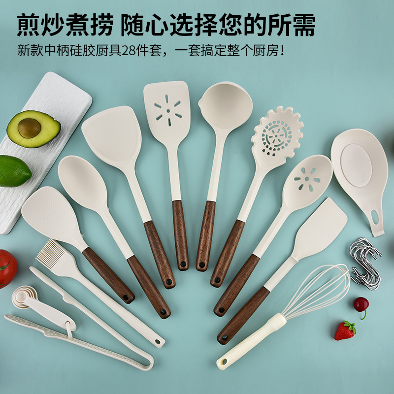 Fábrica directa de nuevo mango de madera de silicona cocina conjunto de venta caliente transfronteriza 28 piezas de conjunto de cocina antiadherente para paneles especiales