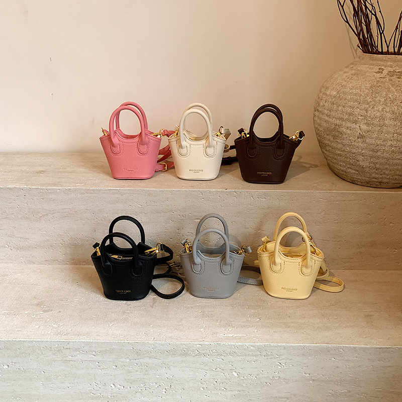 Bagos de cestas de verduras para niños 2025 nuevo estilo coreano simple color sólido bolso de mochila para niños estilo extranjero mini bolso de niña