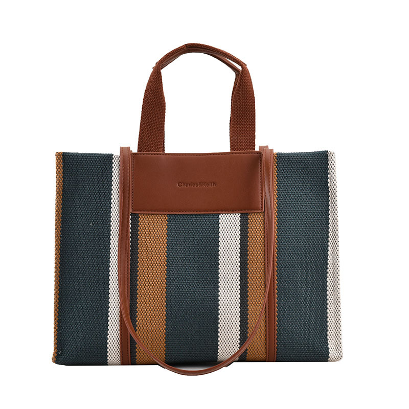 Bolso de mujer nueva línea transfronteriza lienzo color contraste bolso de mano rayas nicho de moda alta moda bolso de hombro