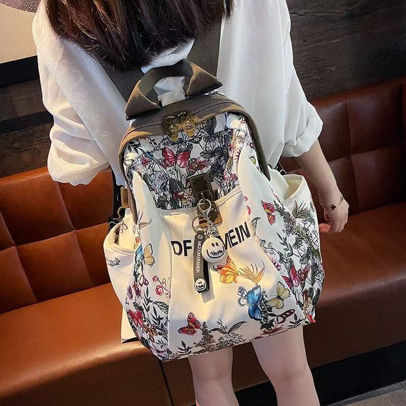 Perezoso viento alto valor de la cara explosivo estilo de moda extranjero anti-sucio damas mochila de viento 2025 mochila de viaje