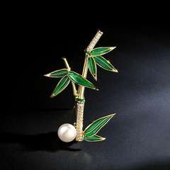 High-end Chinese-style bamboo brooch for women, exuding elegance and a sense of continuous rise, fashionable and sophisticated, featuring pearl embellishments as accessories.