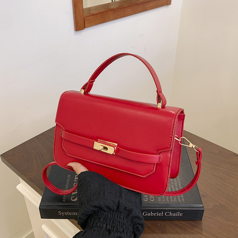 Bolso de mano de color sólido nuevo estilo 2025 simple bolso de hombro de primavera coreano de moda con cierre bolso pequeño