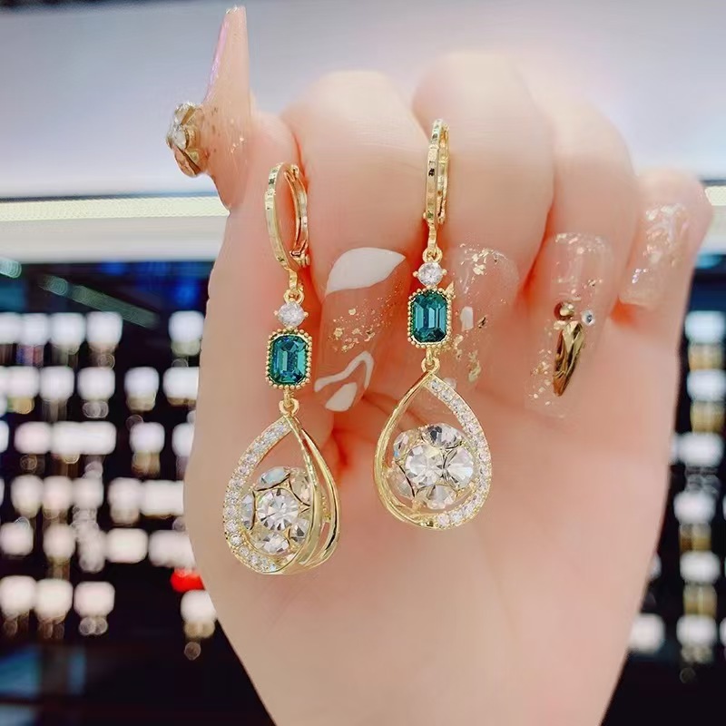 Design earrings drop-shaped, trend of season, light luxury style