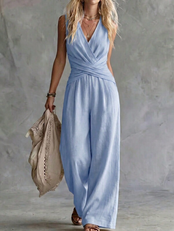 European and American style summer linen sleeveless V-neck jumpsuit with a crossover twist design, cinched waist, loose fit, and wide legs, perfect for a vacation European and American style summer linen sleeveless V-neck jumpsuit with a crossover twist design, cinched waist, loose fit, and wide legs, perfect for a vacation