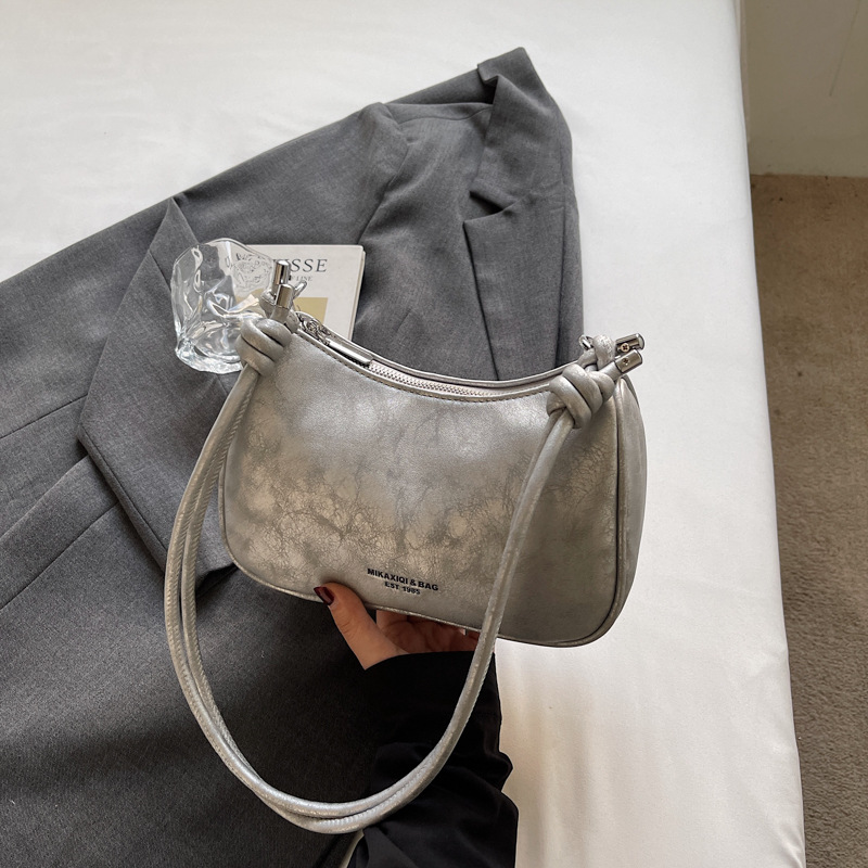 Bolsa de brazo de moda retro para mujeres 2026 primavera nueva simple diaria bolsa de bolsas de bolsillo de alto valor coreano hombro único