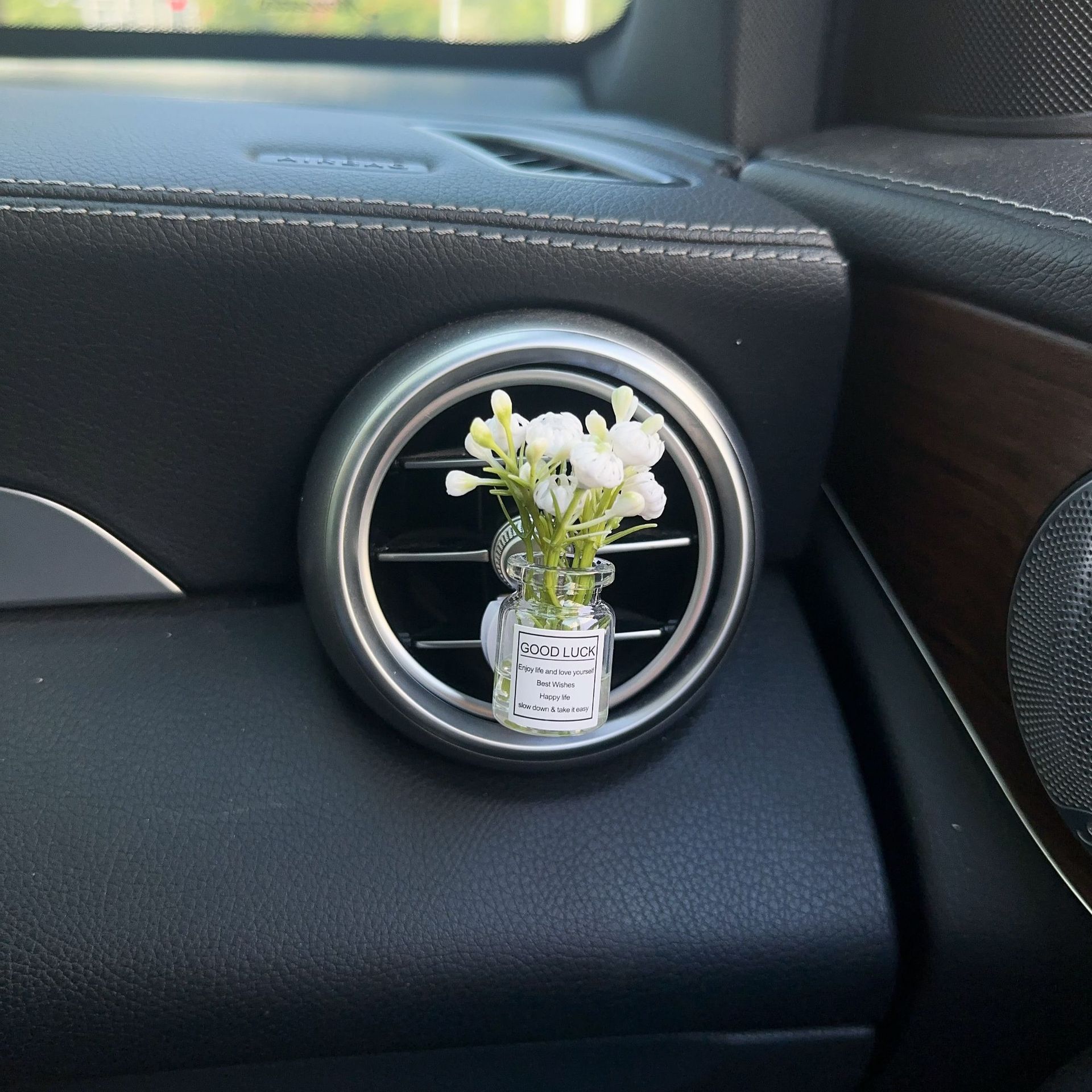 Decoración creativa de salida de aire del automóvil con flores de estrellas pequeñas frescas aire acondicionado botella de perfume de perfumes