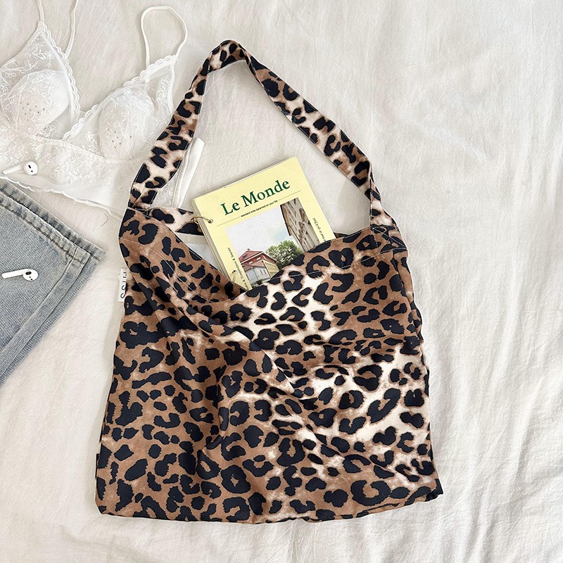 Diseño nicho bolsas de lona para mujeres 2025 nueva gran capacidad coreana estampado de leopardo flor de hombro impresa bolsas de mujer