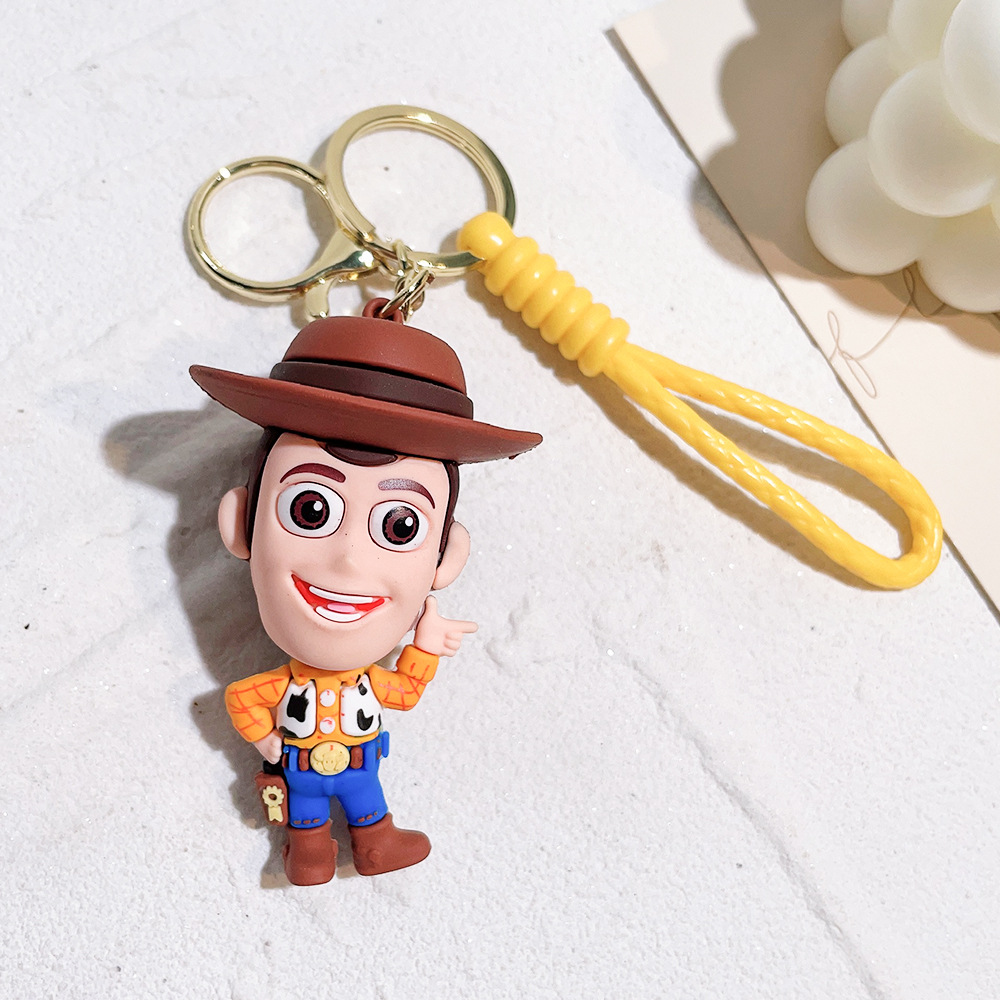 Llavero de silicona de Toy Story, el popular dibujo animado, con personajes como el alienígena de tres ojos, Buzz Lightyear y el oso Lotso, ideal como adorno para bolso.