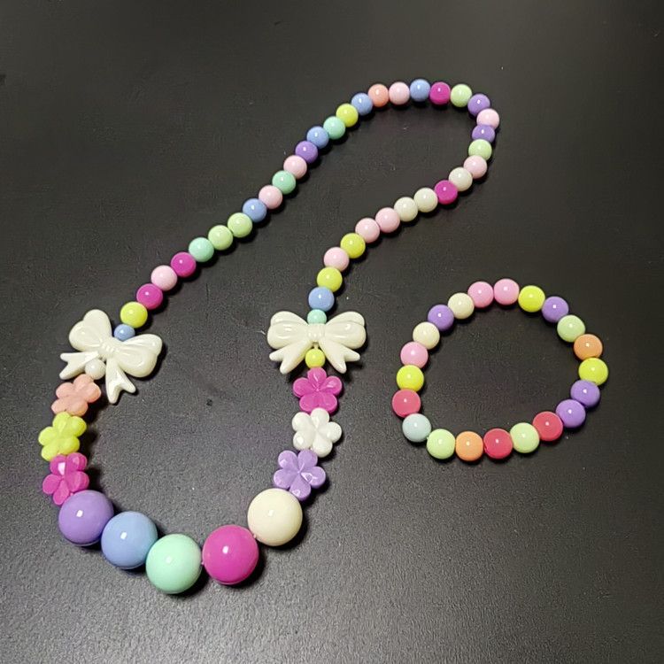 Colorful beaded double bow tie