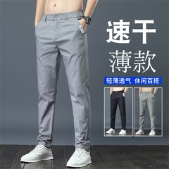 シャツの少ない服装の夏の薄いタイプのビジネスのズボンの速乾のレジャーのファッションの潮流は青少年の直筒の氷のズボンを修理します。