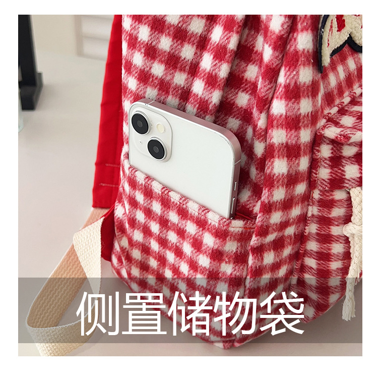 The large-capacity red woolen checkered backpack for primary and secondary school students is a unique and versatile choice. It's a trend for girls to carry backpacks during their leisure trips undefined